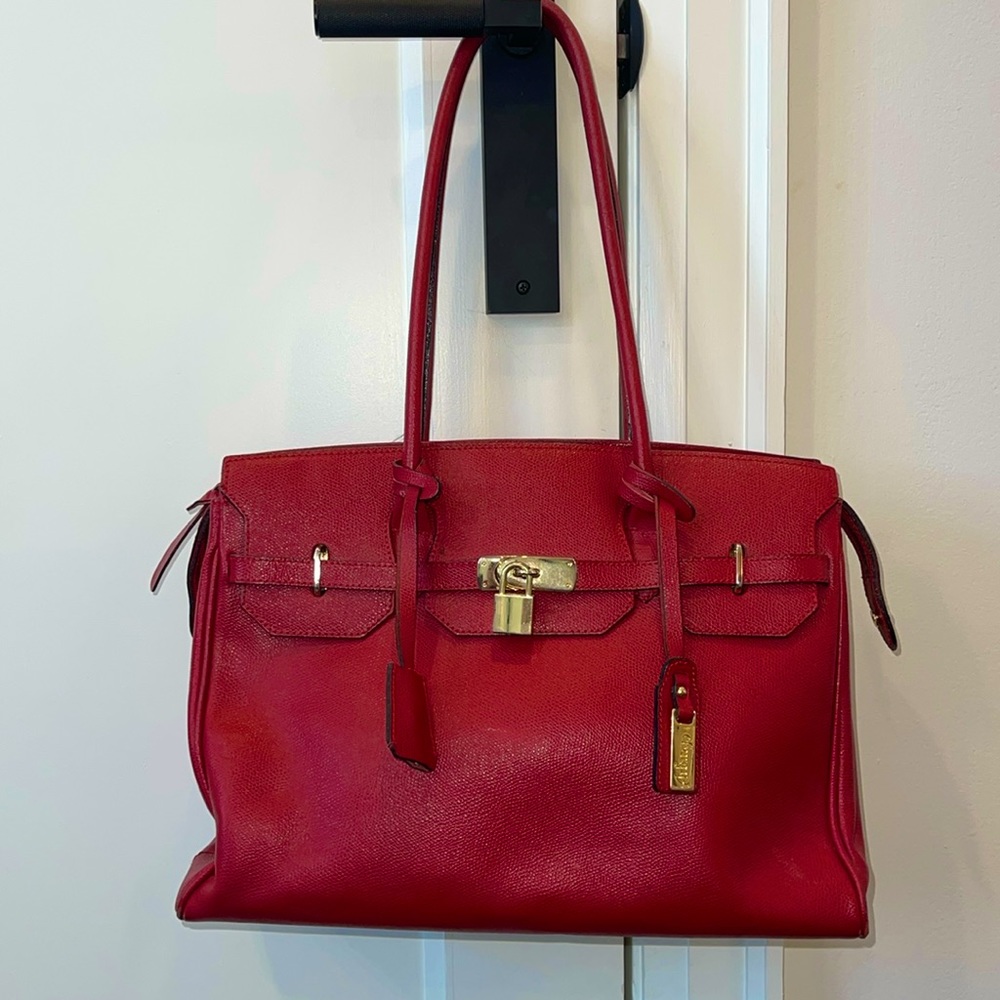 Arfango red leather bag.